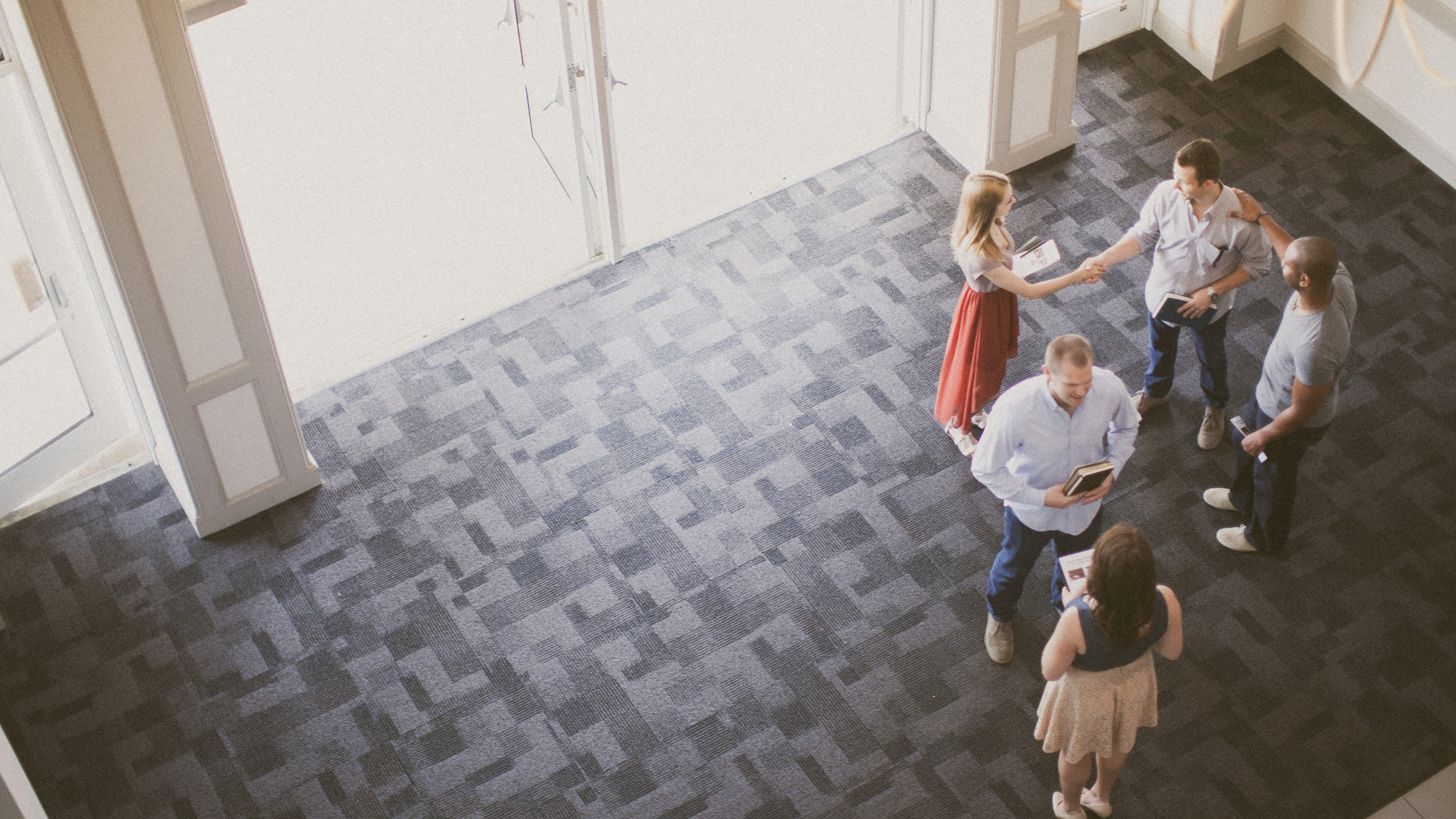 Guests greeted in a church foyer.