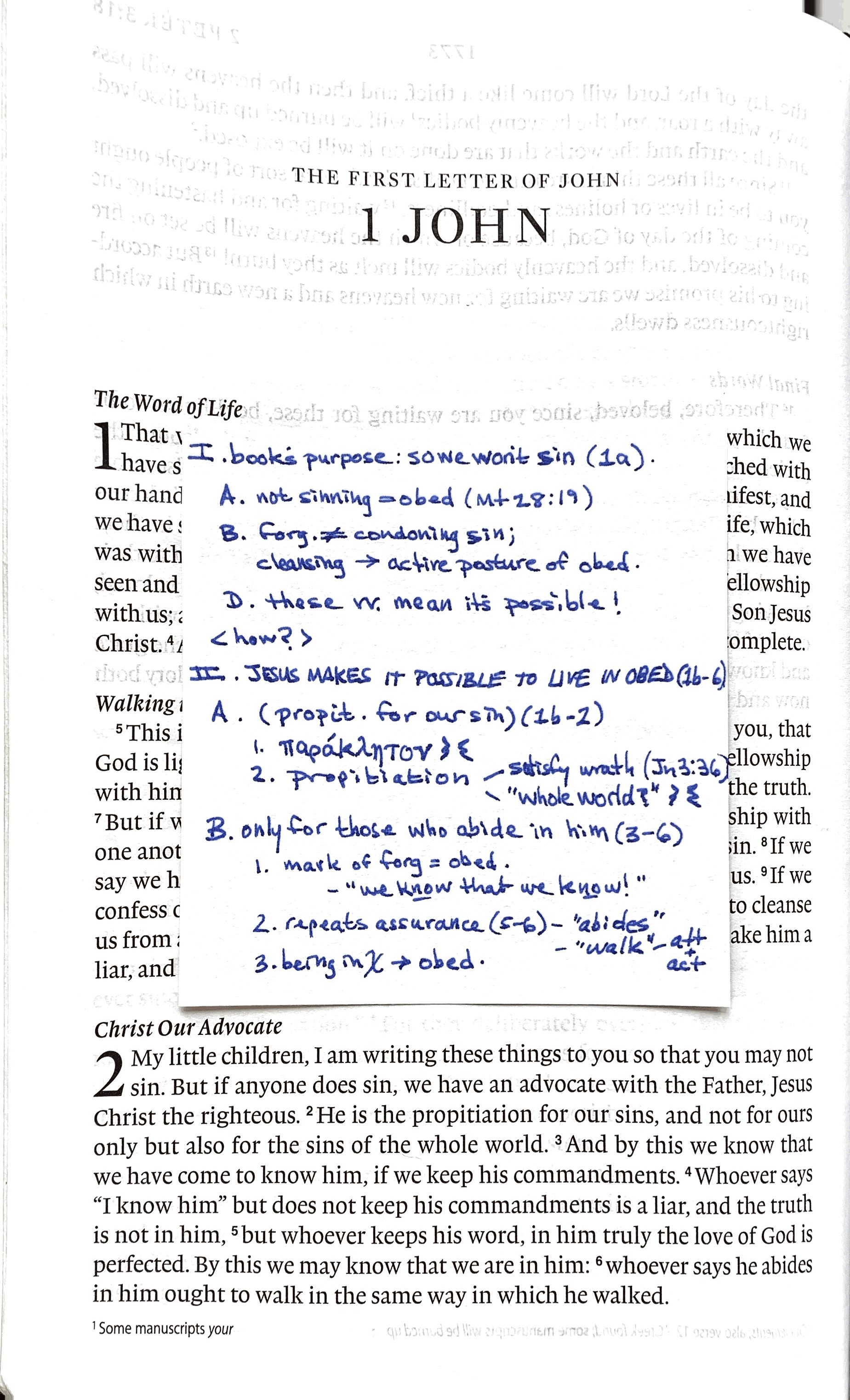 A photo of the first page of 1 John with a sticky note on the page that contains notes
