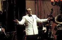 Elvis Costello belts out 'Let's Misbehave' — an apparent theme in Porter's life