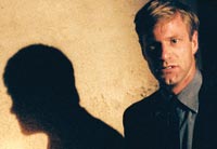 Aaron Eckhart does NOT play a shadowy figure in this movie