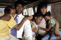 Paul Rusesabagina (Don Cheadle) and wife Tatiana (Sophie Okonedo) protect their family
