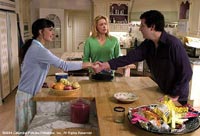 John (Sandler) meets Flor (Paz Vega) while his wife (Leoni) looks on