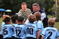 The coaches rally their team for the game