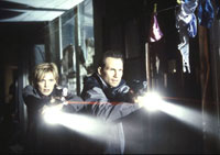 Kathryn Morris as Sara and Christian Slater as J.D. Reston