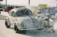 Actual NASCAR drivers Jeff Gordon and Jimmie Johnson, here with Lohan, appear in the movie