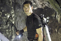 Eddie Cibrian says, "All I need down here to survive is my scuba tank, my grappling hook, and my dashing good looks."