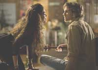 Mimi (Rosario Dawson) puts some moves on Roger