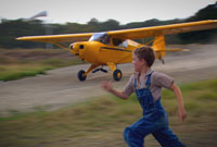 Chase Ellison as the young Steve Saint, seeing his father off