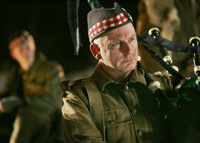 Gary Lewis as Palmer, the Scottish priest