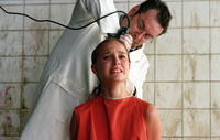 Evey experiences a few close shaves in the film, none closer than this one