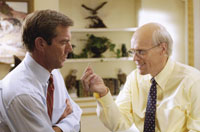 The Chief of Staff (Willem Dafoe) tries to get to put in an earpiece