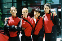 Curley (2nd from left) and co-stars Vanessa Lengies, Nikki SooHoo, and Missy Peregrym.