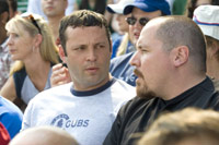 Johnny O (Jon Favreau, right) takes in a Cubs game with his best bud, Gary