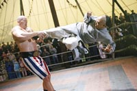 An American strongman (Nahan Jones) takes Huo for a ride