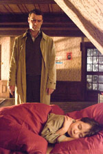 Robert Thorn (Liev Schreiber) checks on his son Damien, who is beginning to have some 'behavior issues'