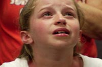 Nine-year-old Tory Binger lets the tears flow