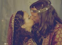 Esther (Tiffany Dupont) and Xerxes share a kiss