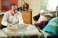 Hank reads a bedtime story to Emily's son (Devin Brochu)