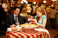 Robert (Patrick Dempsey) and Giselle have a laugh over a pizza