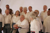 Chorus members have a laugh during a practice