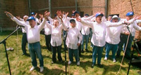 The choir hams it up at a performance