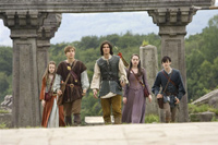 Caspian (center) and the Pevensie kids in Narnia