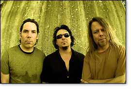 The Seventy-Sevens in 2008: drummer Bruce Spencer (left), guitarist/singer Mike Roe, and bassist Mark Harmon.