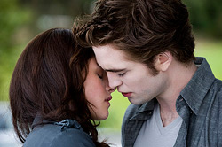 Kristen Stewart as Bella, Robert Pattinson as Edward