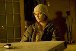 Charlize Theron as the man's wife