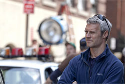 Director Neil Burger on the set