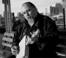With one of his cigar box guitars
