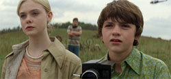 Elle Fanning as Alice, Joel Courtney as Joe
