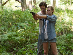 Patrick shows Martha how to use a gun