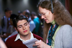 Actor Greg Sulkin on the set with Moore