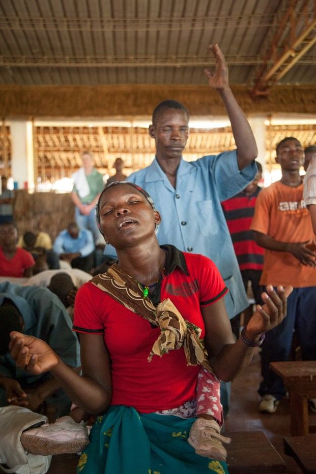 Worshipers in prayer and praise during a service at the Pemba base.