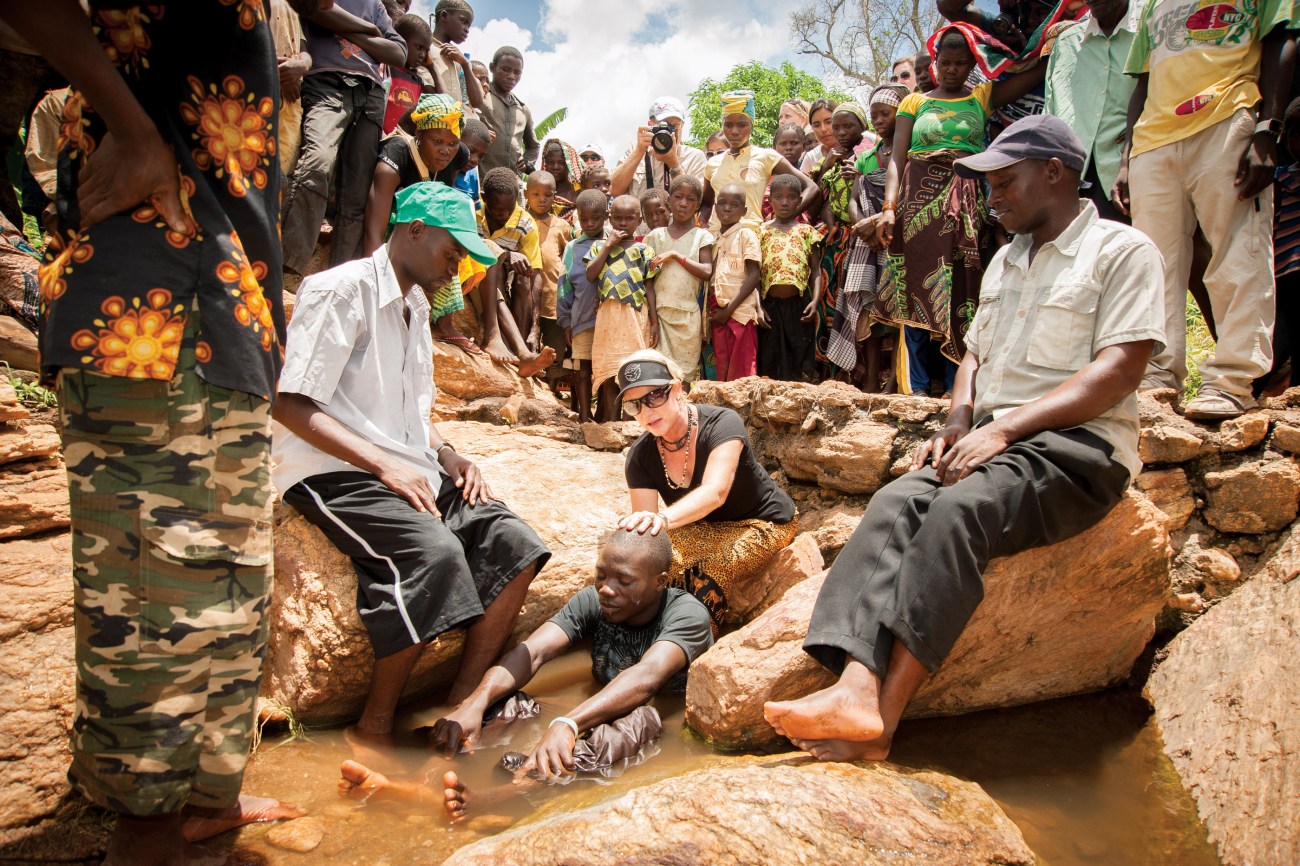 A baptism takes place in a small stream at the end of a two day village outreach. Iris claims 10,000 churches have begun in Mozambique and around the world as a result of these missionary efforts.