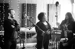Greer shares a laugh with Ann and Regina McCrary