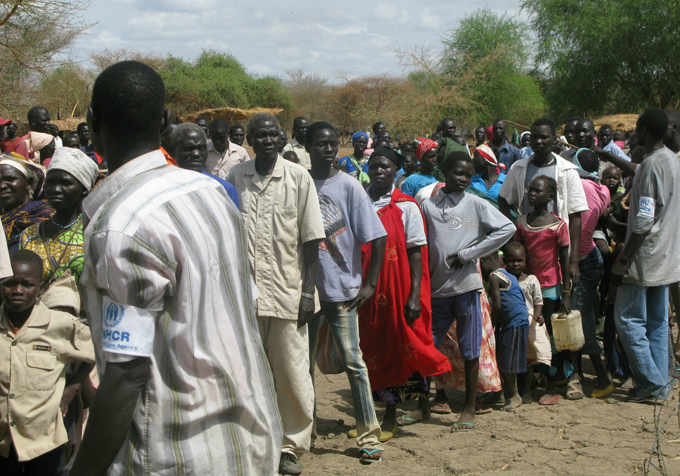 Refugees in South Sudan line up to receive international aid.
