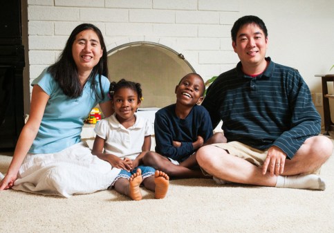 Grace and Matt Huang with two of their three adopted children.