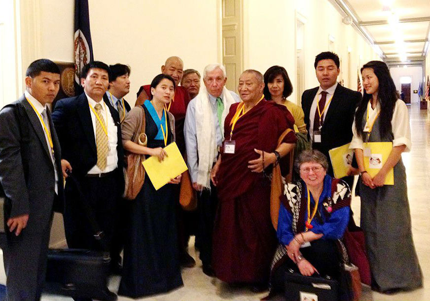 Frank Wolf (middle) meets with Tibet advocates in 2012.