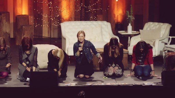 Jennie Allen, center, prays with Rebekah Lyons, Ann Voskamp, Esther Havens, Melissa Greene, and Jen Hatmaker.