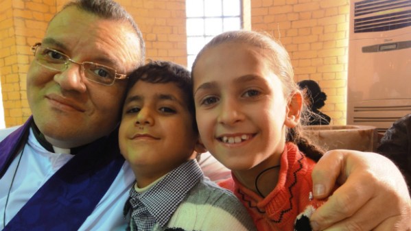 Canon Andrew White with children at St. George's Baghdad.