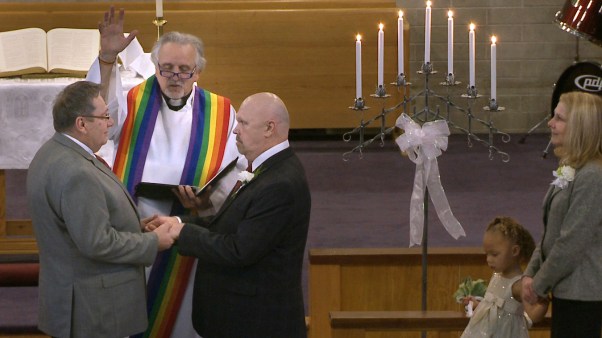 Methodist pastor Gordon Hutchins officiates at a same-sex union in Tacoma, Washington, in 2013.