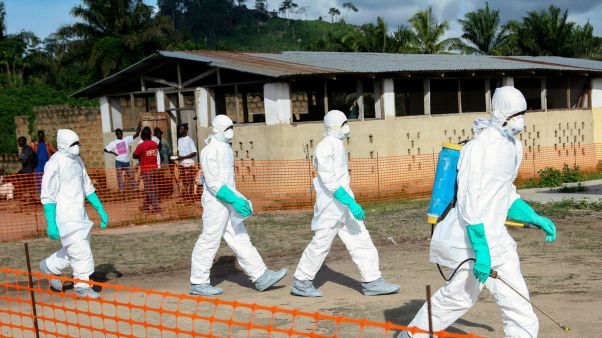 Health workers in Liberia work among victims of Ebola.