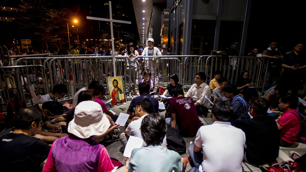 Christians pray during a demonstration outside the government headquarters in Hong Kong.