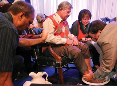 Peter Joudry washes feet of former pastor Don Fisher.