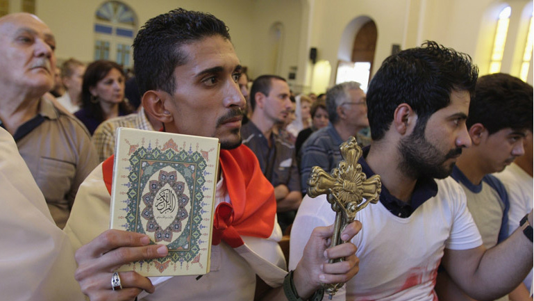 Displaced Christian refugees from Mosul attend worship in Erbil, Iraq.
