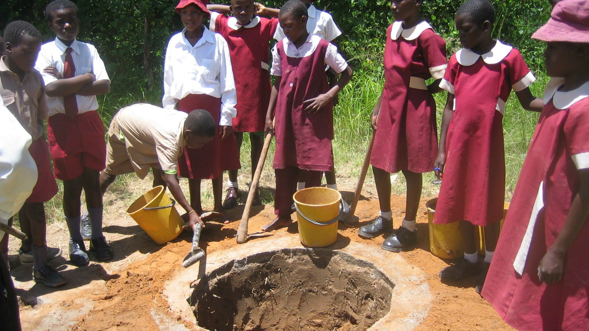 Zimbabwe schoolchildren complete an Arborloo, a new kind of pit latrine that will be used to plant a fruit tree after the pit is full of waste.