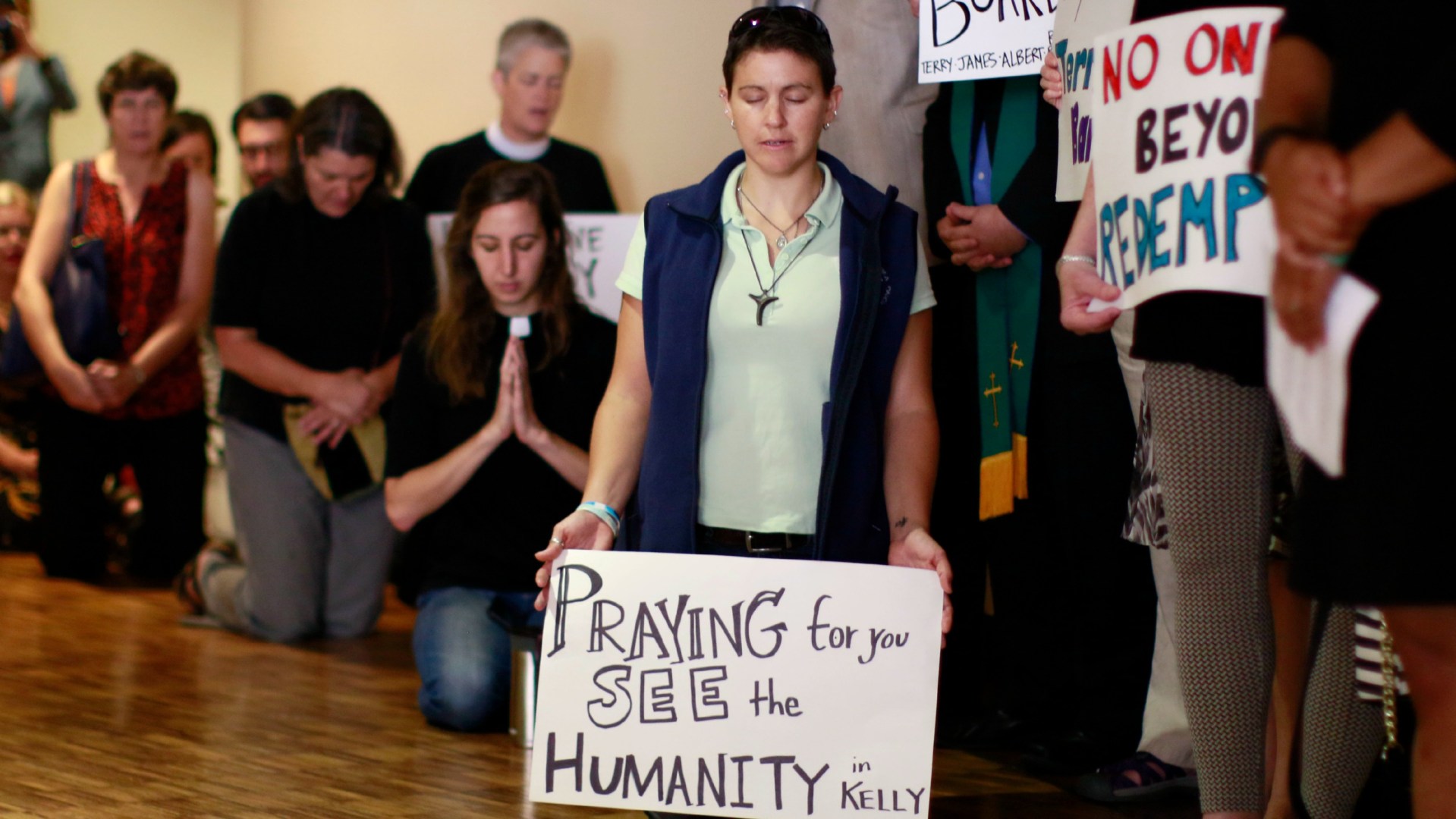 Demonstrators pray before Georgia inmate Kelly Gissendaner's execution last month.