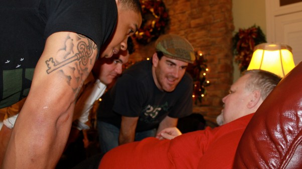 Wayne Jolley (right) often teaches and counsels Ed Cash (in cap) and others from his oversized recliner.